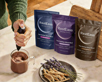 Person making a hot drink with RestEase products on a marble surface.